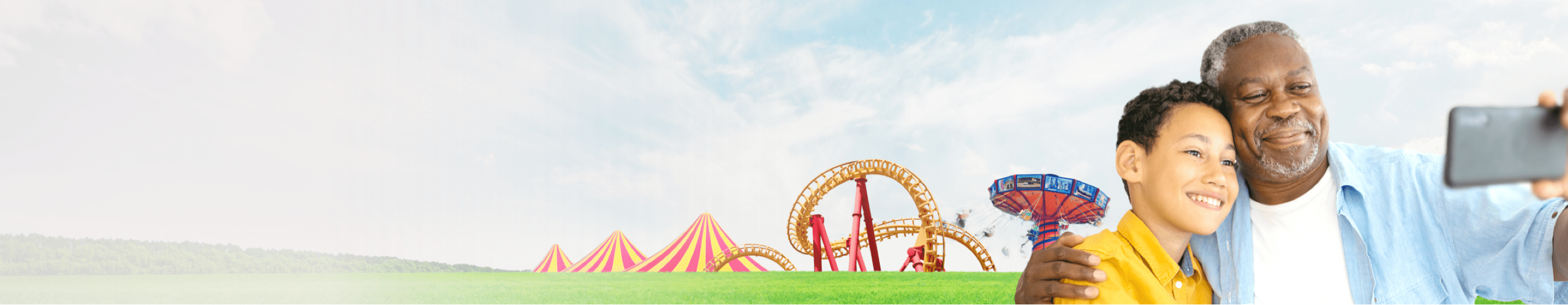 Adult and child taking a picture outside a theme park